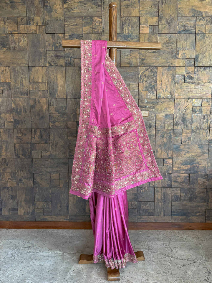Elegant lilac Banarasi Jamawar satin silk saree with exquisite hand-embroidered buttis, perfect for weddings and celebrations.