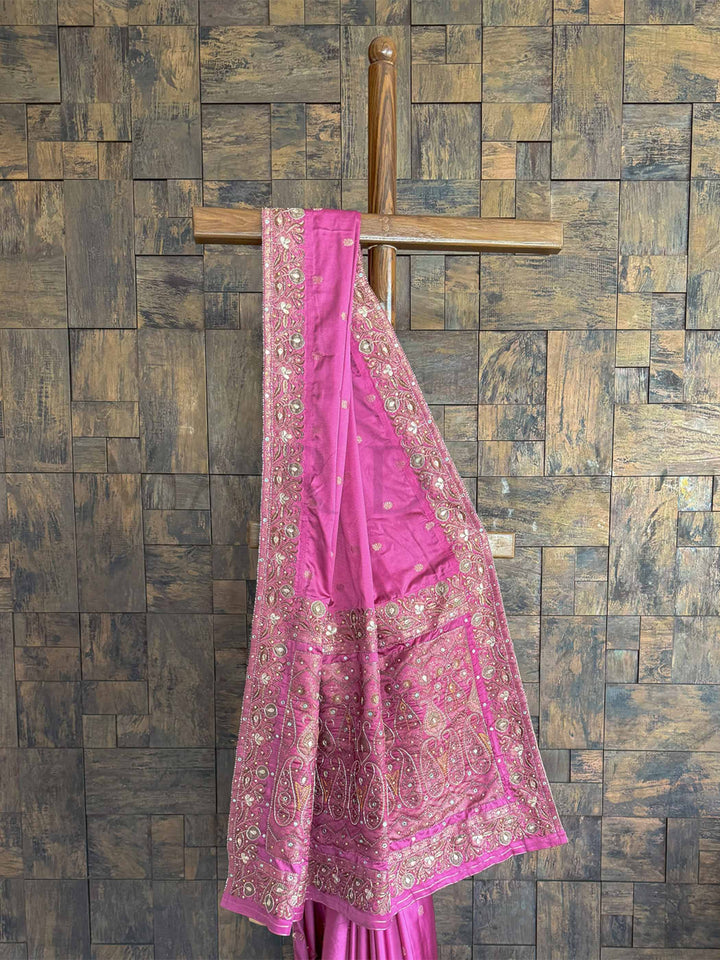 Graceful lilac satin silk saree featuring traditional Banarasi Jamawar weaving and intricate hand-embroidered buttis.