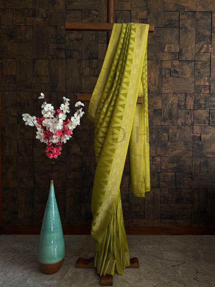 Lime green soft georgette saree with golden woven zari work for Haldi