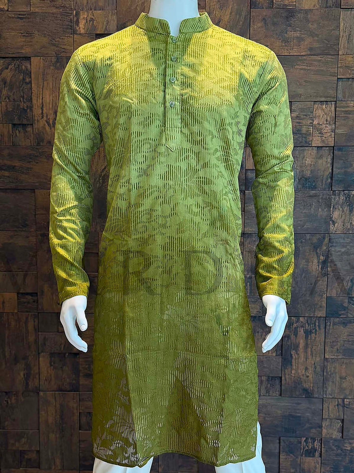Green patterned kurta on a mannequin against a wooden paneled wall Full-length view of men’s teal ombré jacquard kurta with long sleeves and curved hem ideal for wedding functions, receptions and festive gatherings.