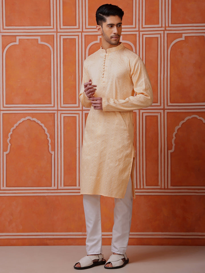 Stylish peach traditional kurta for men, perfect for summer festivities and cultural events