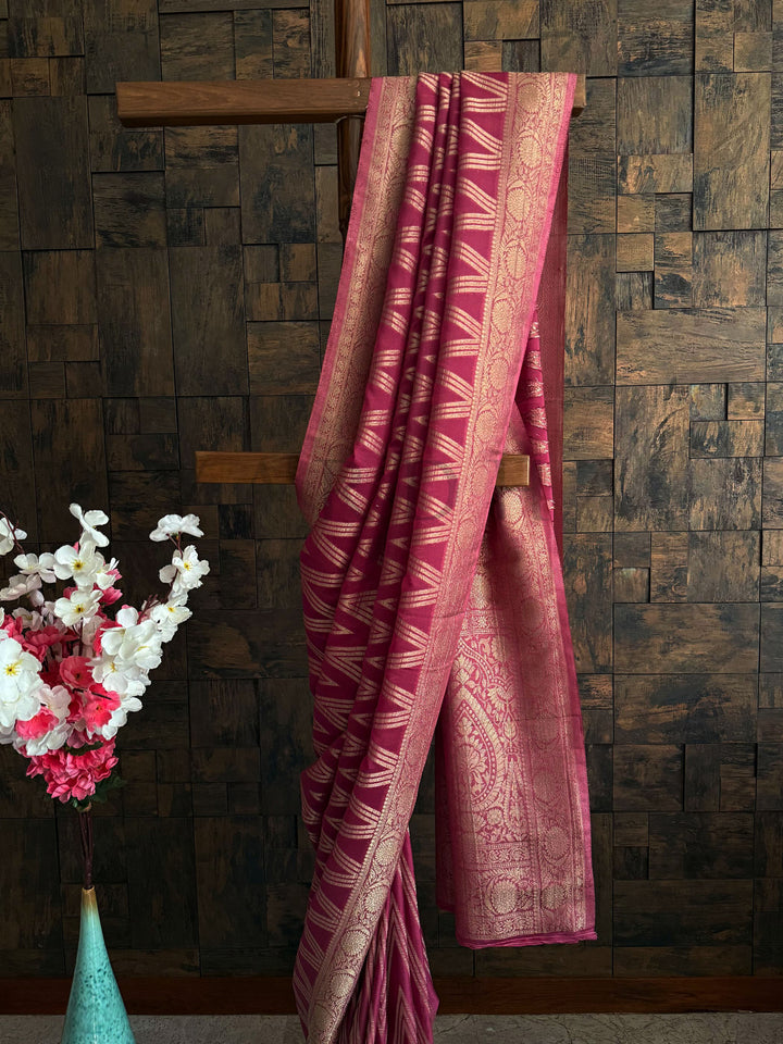 Ethnic georgette saree with detailed weaving and festive pink tones – woman’s classic pick.
Trending soft georgette saree for women in rose pink with gold detailing and sleek finish.
Handwoven rose pink saree in soft georgette – festive edit with heritage-style golden work.