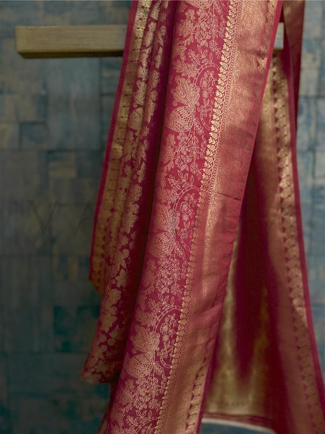 Blouse piece in matching rust tone with gold zari work featuring traditional bird and floral motifs - unstitched and rich in detail. - Elegant rust and gold kanjivaram saree pallu displayed flat - highlighting brocade texture and jacquard weaving for traditional occasions