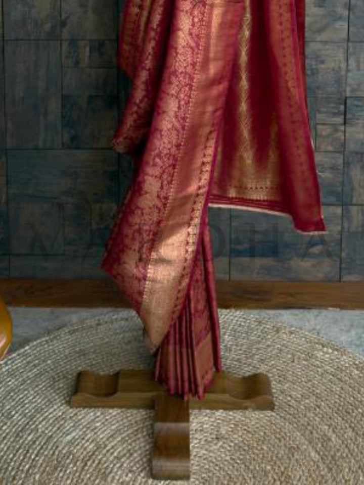 Maroon Rust colored kanjivaram saree with elaborate golden zari work - richly textured and ideal for weddings or heritage functions. - Zari woven detailing and brocade motifs on the rust kanjivaram silk saree - styled for ethnic ceremonies and grand cultural events