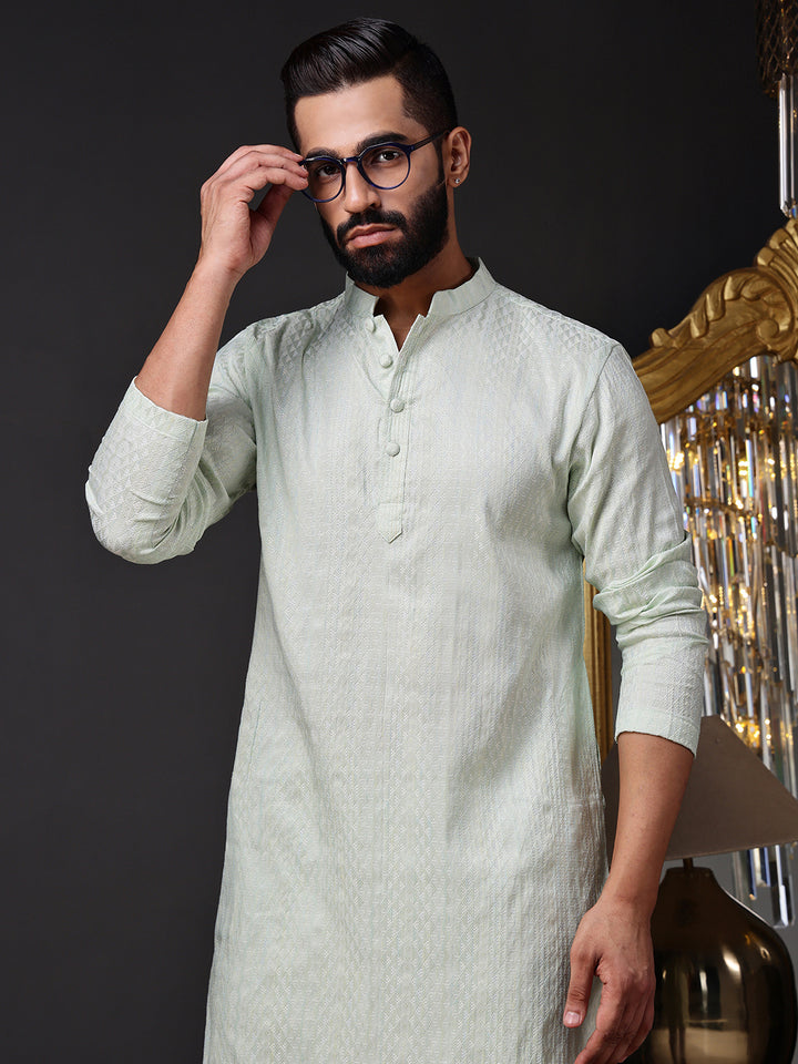 Refreshing mint green kurta for men featuring a subtle self-design geometric weave, perfect for daytime events