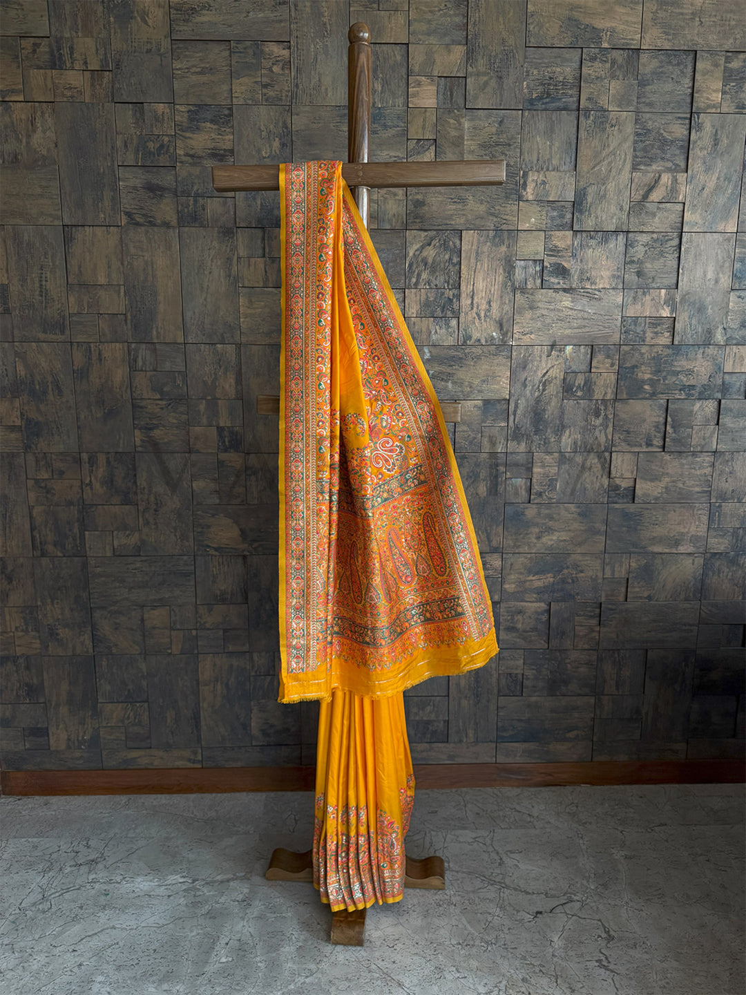 Graceful mustard-yellow Pashmina raw silk saree adorned with intricate embossed thread work for a sophisticated and timeless appeal.