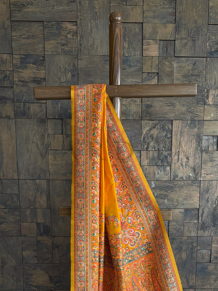 Mustard-yellow raw silk saree with a soft Pashmina texture and exquisite embossed thread detailing, perfect for festive elegance.