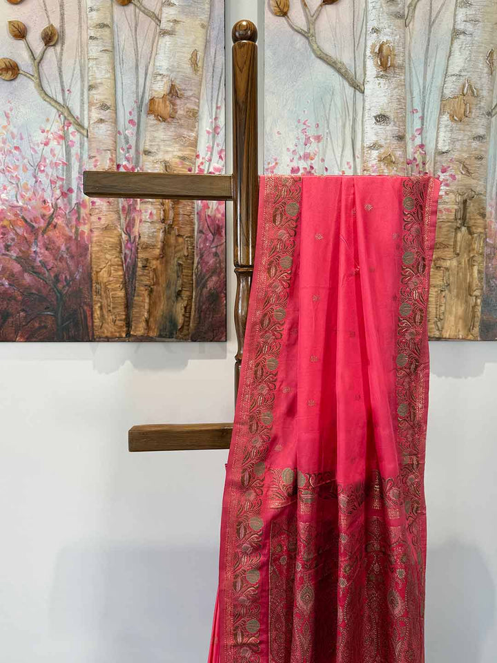 Neon Fuchsia traditional satin saree featuring Jamawar weaving, designed for festive occasions like weddings and celebrations.