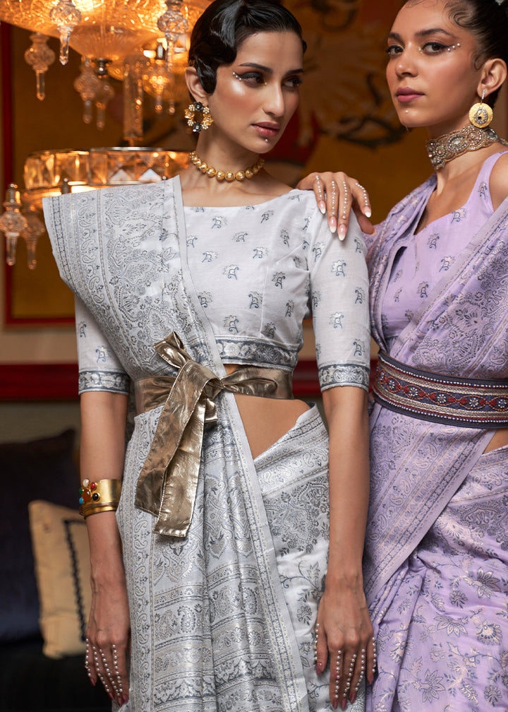 Designer off white Kashmiri silk saree adorned with floral patterns and crafted with modal handloom weaving.