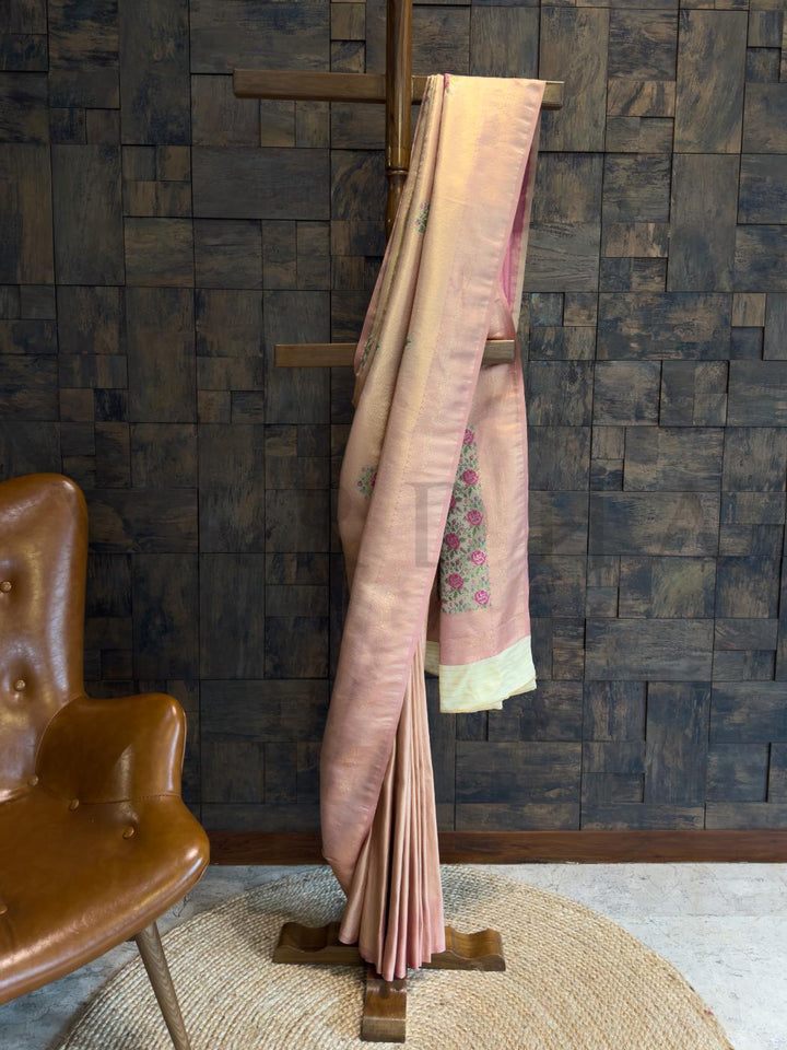 Pastel peach kalamkari art silk saree with gold woven border and digital floral motifs, perfect for cultural and festive wear., Close-up view of saree pallu showcasing kalamkari floral digital print in pink and green over soft art silk base