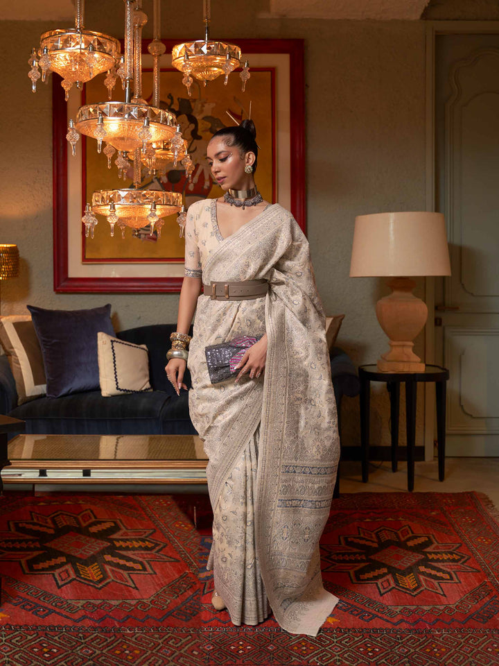 Pastel Brown Kashmiri Modal Silk Saree featuring Intricate Floral Weaving and Handloom Craftsmanship, offering a Luxurious Drape for Elegant Occasions.