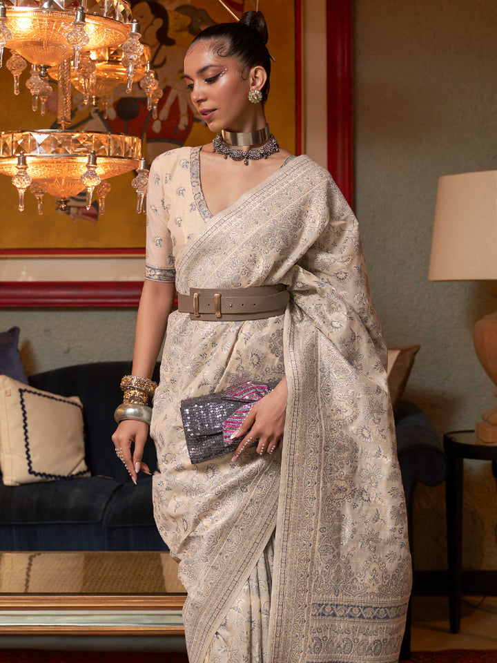 Handcrafted Pastel Brown Kashmiri Silk Saree with Floral Motifs and Fine Handloom Weaving, ideal for those seeking Authentic Ethnic Wear with a Contemporary Touch.