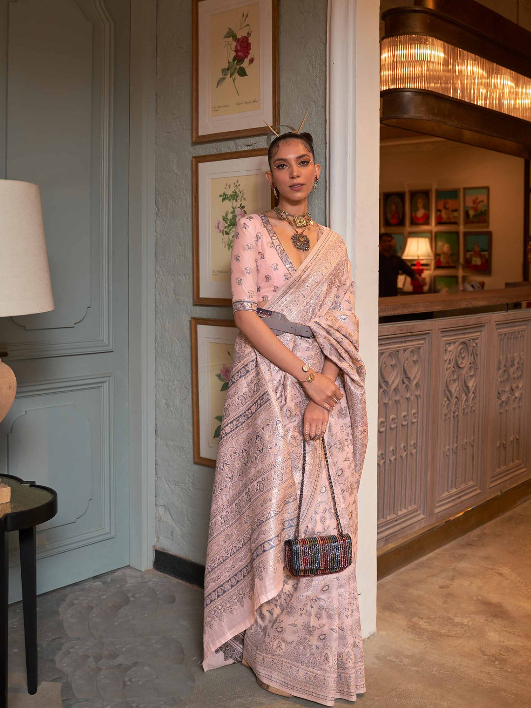 Peach Kashmiri Modal Silk Saree featuring Intricate Floral Weaving and Handloom Craftsmanship, offering a Luxurious Drape for Elegant Occasions.