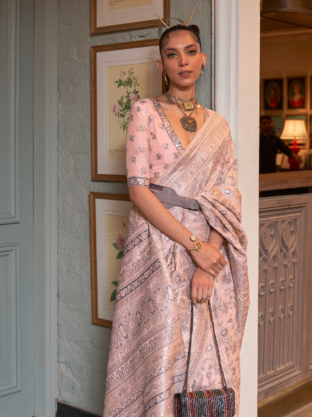 Elegant Peach Floral Woven Saree in Kashmiri Modal Silk, showcasing Traditional Handloom Techniques and Exquisite Floral Patterns, perfect for Cultural Celebrations.