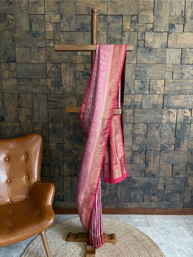 Pink Kalamkari Art Silk Saree with zari work border and peacock motifs for festive occasions.	Traditional pink cream saree in art silk with intricate Kalamkari patterns and rich zari detailing.