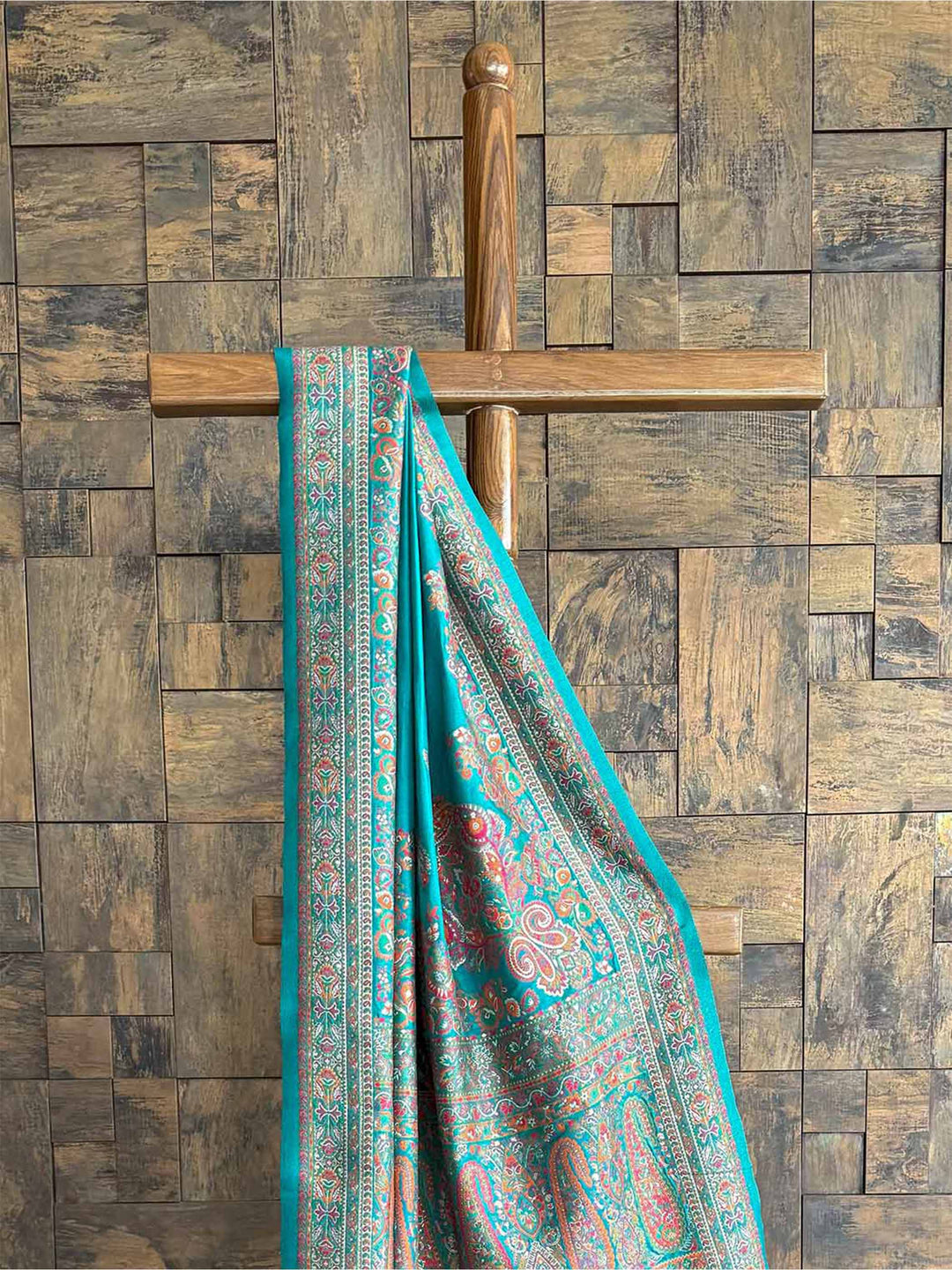 Rama blue raw silk saree with a soft Pashmina texture and exquisite embossed thread work, ideal for festive and formal occasions.