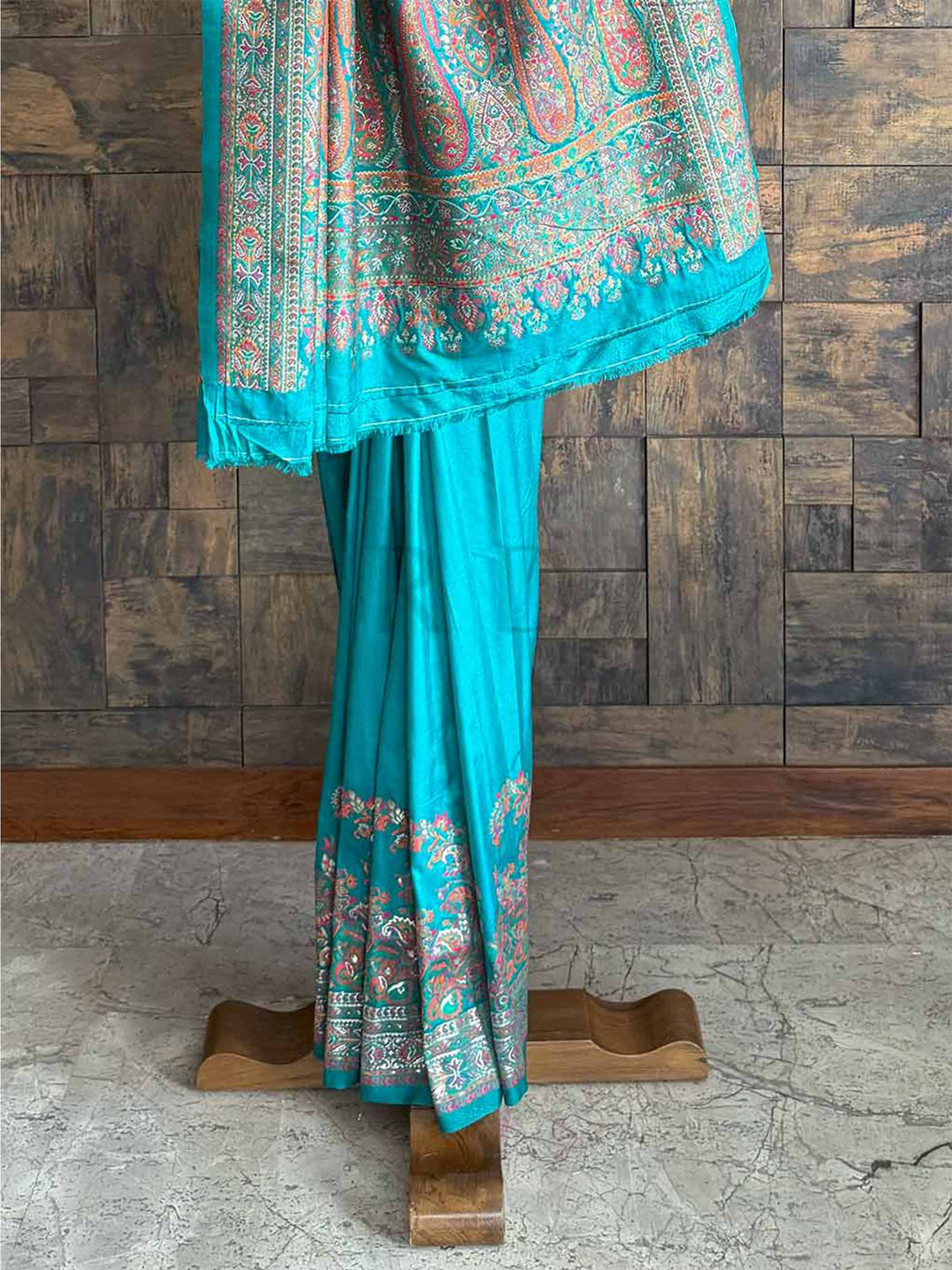 Stunning Rama blue Pashmina raw silk saree with fine embossed thread detailing, showcasing artisanal craftsmanship and graceful charm.