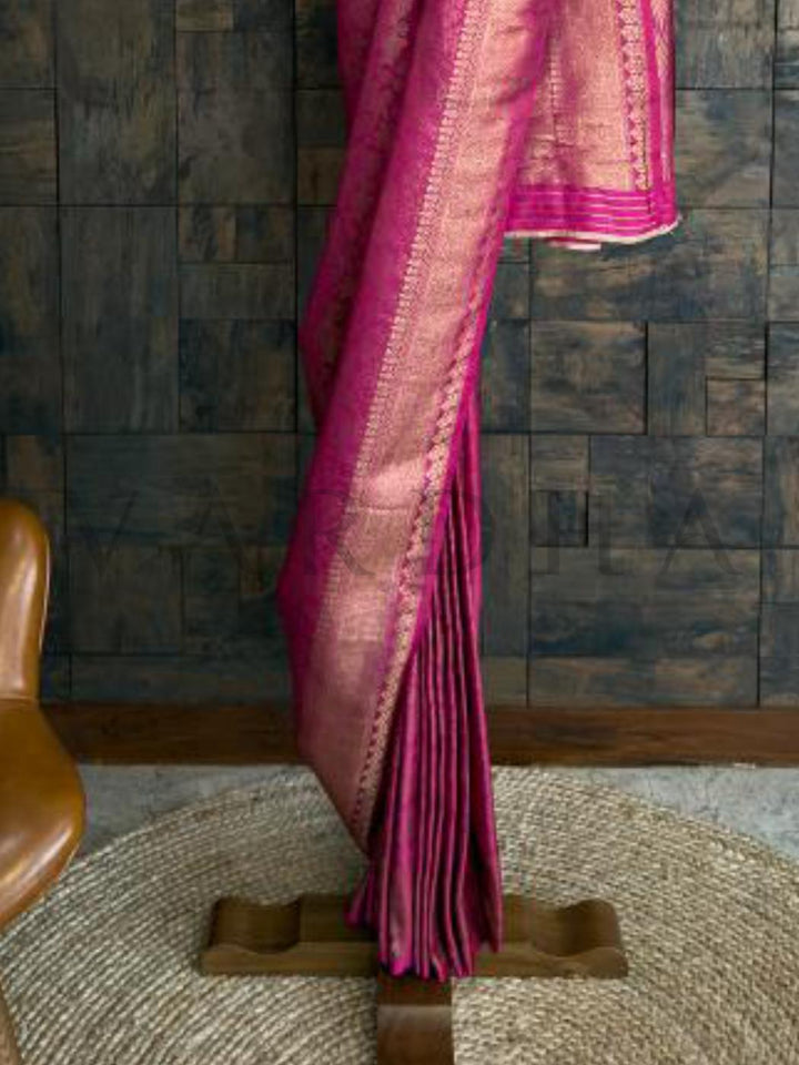 Full view of saree on stand emphasizing detailed pallu work and broad zari borders for party-perfect styling. - Rani pink and gold kanjivaram silk saree featuring jacquard weaving - perfect for sangeet - parties - and receptions