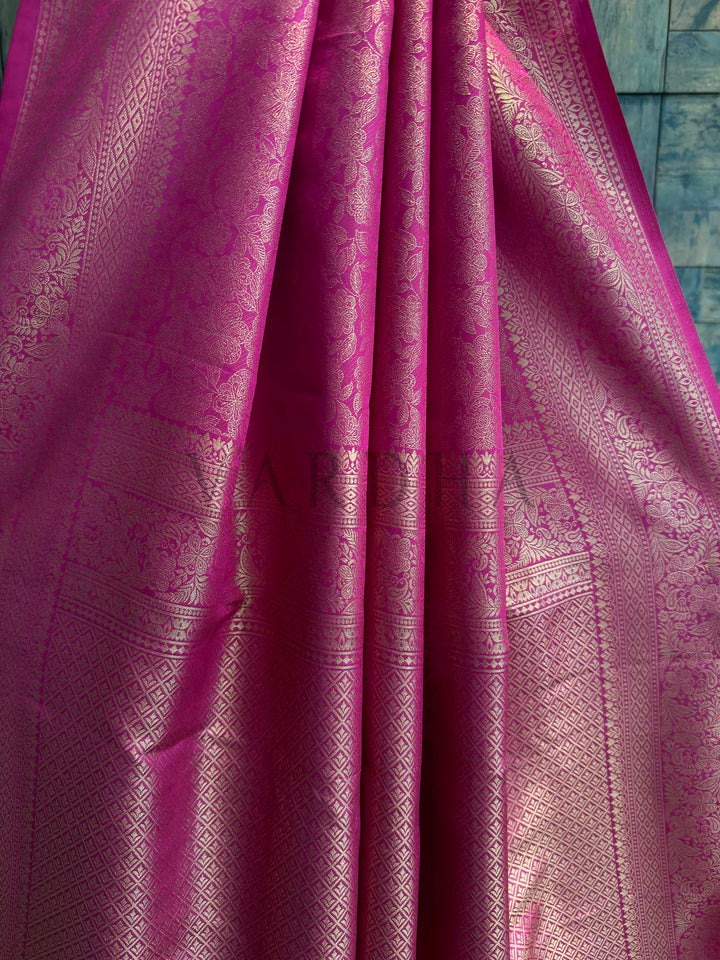 Angled pallu shot displaying heavy woven zari motifs—floral vines and geometric patterns—radiant Kanjivaram art silk.