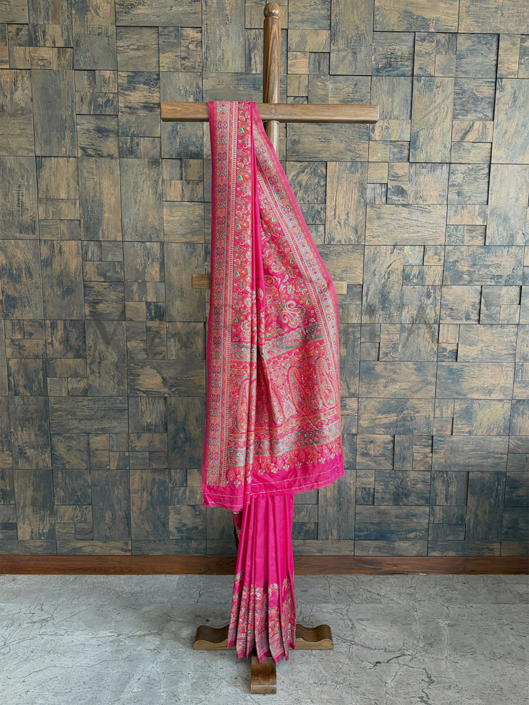 Stunning Rani Pink Pashmina raw silk saree with intricate embossed thread work, perfect for grand occasions.