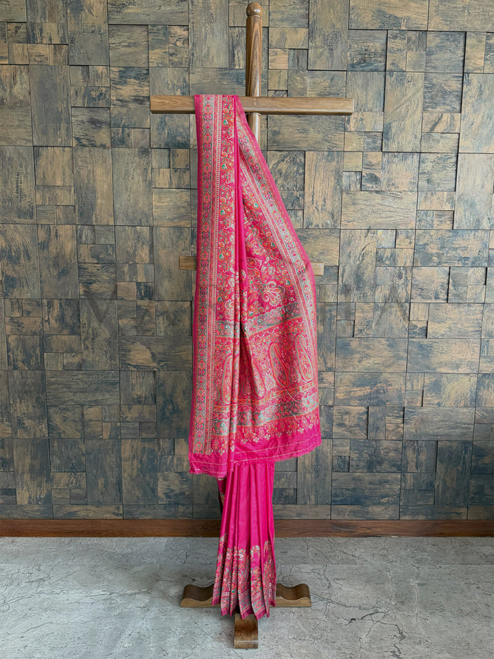 Stunning Rani Pink Pashmina raw silk saree with intricate embossed thread work, perfect for grand occasions.