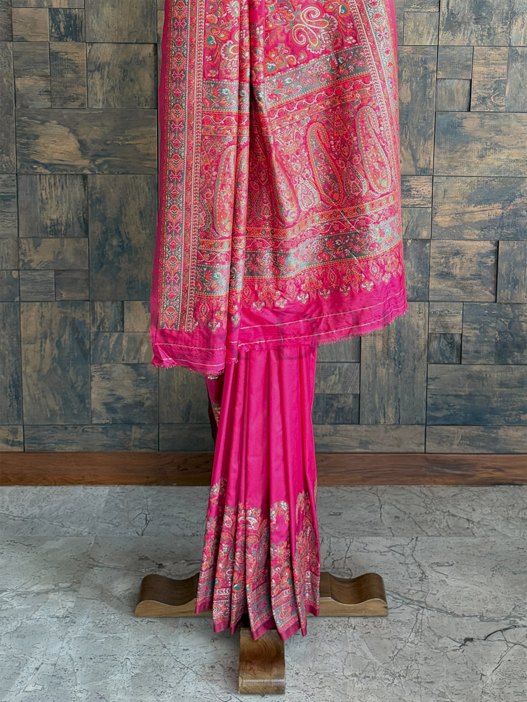 Graceful Rani Pink raw silk saree with Pashmina richness and embossed thread embroidery, exuding timeless beauty.