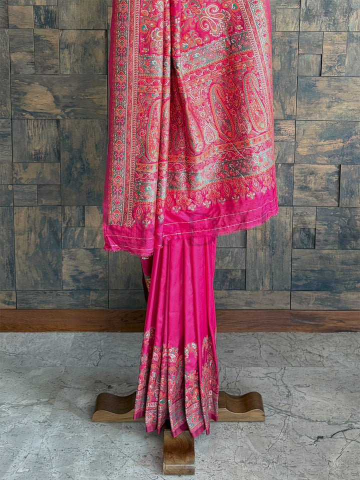 Graceful Rani Pink raw silk saree with Pashmina richness and embossed thread embroidery, exuding timeless beauty.
