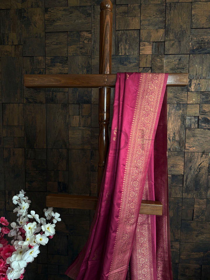 Traditional rose pink satin saree for women with sheen texture and rich ethnic design.
Designer satin saree in soft pink with detailed zari pallu and minimalist floral embroidery.