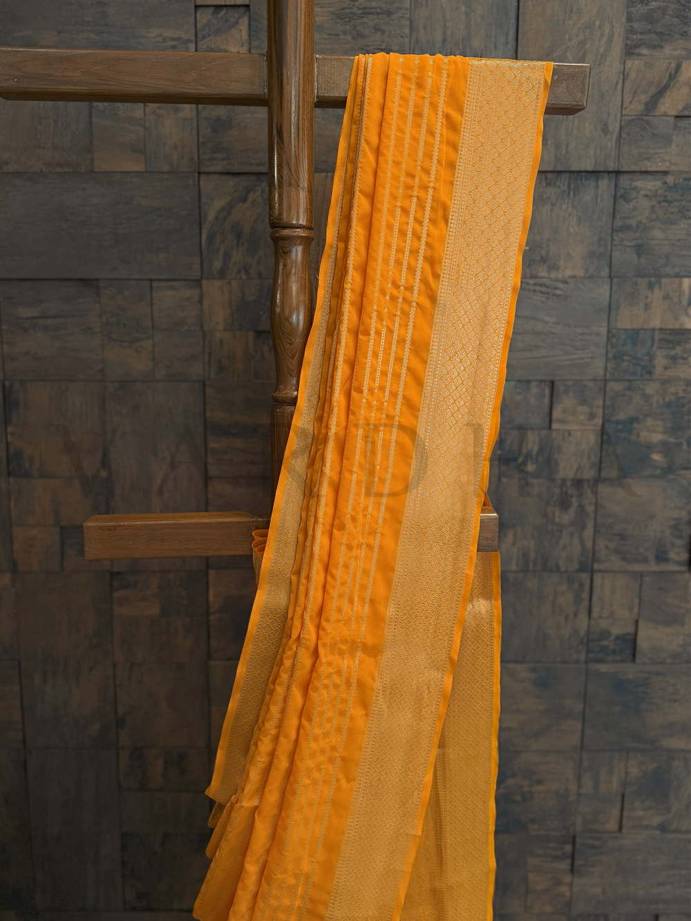 Close-up of upper half showing soft shimmer georgette fabric and intricate gold zari lines in modern alignment., Side drape view of saree showcasing zari pallu in golden hue over airy yellow georgette base, perfect for summer event