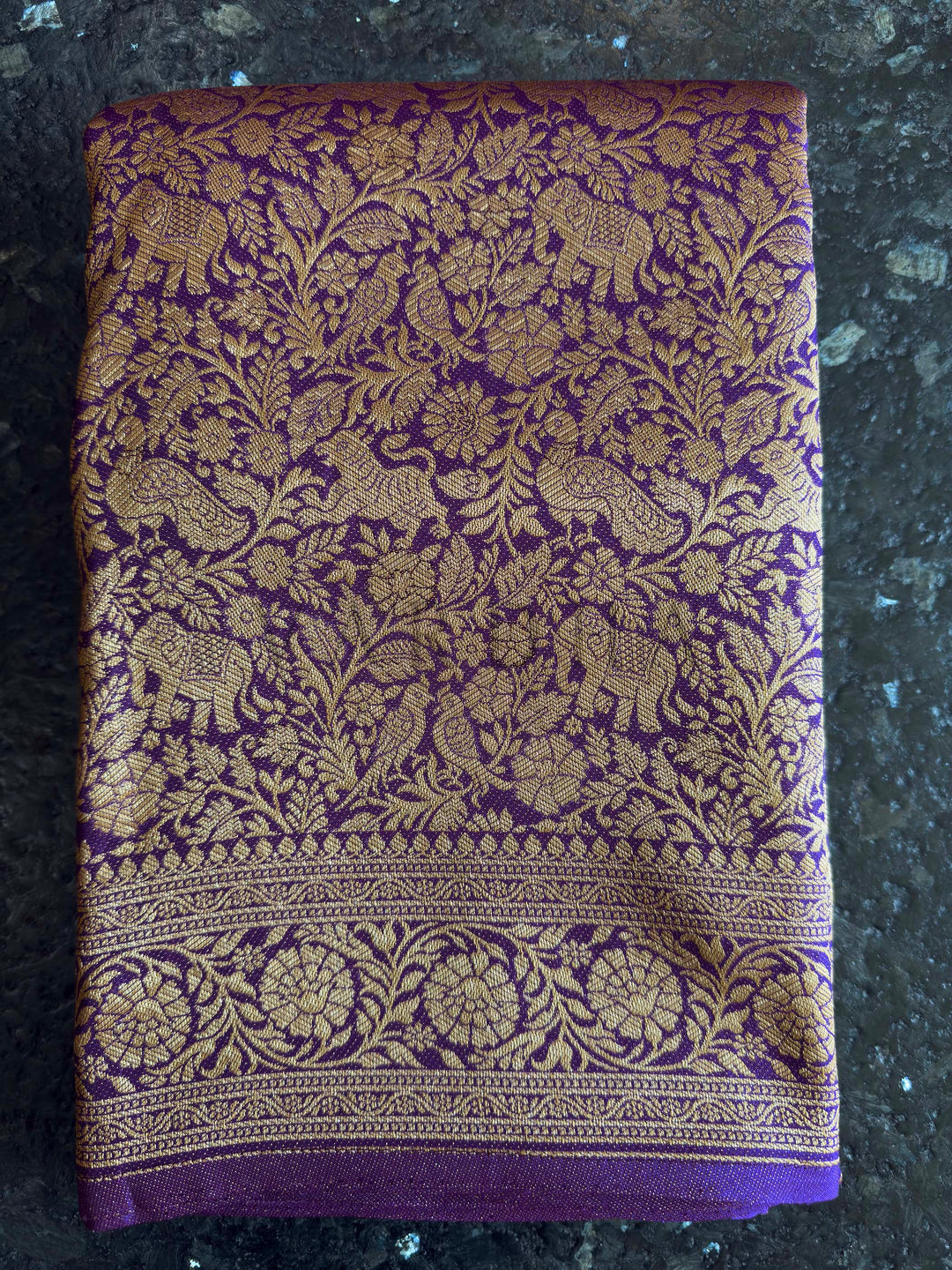 Zari weave texture on pallu highlighting rosette and vine motifs in gold