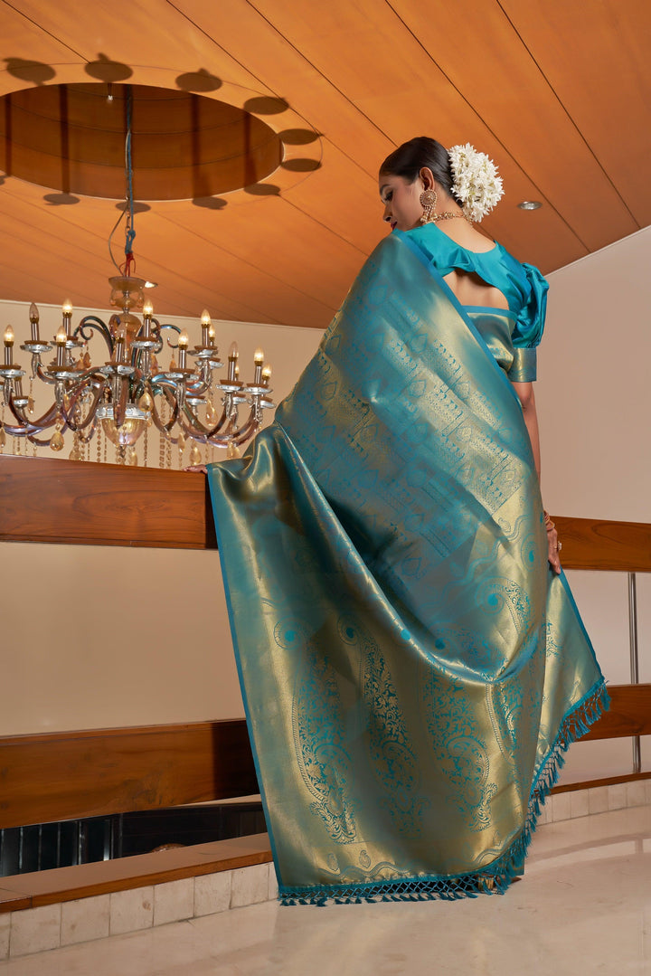 Back view of the saree with pallu on display, emphasizing the elegant flow and zari detail.