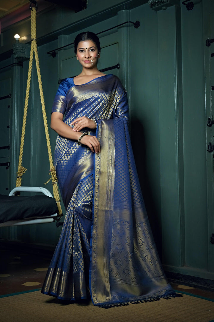 Unstitched blouse piece alongside the saree for styling reference.