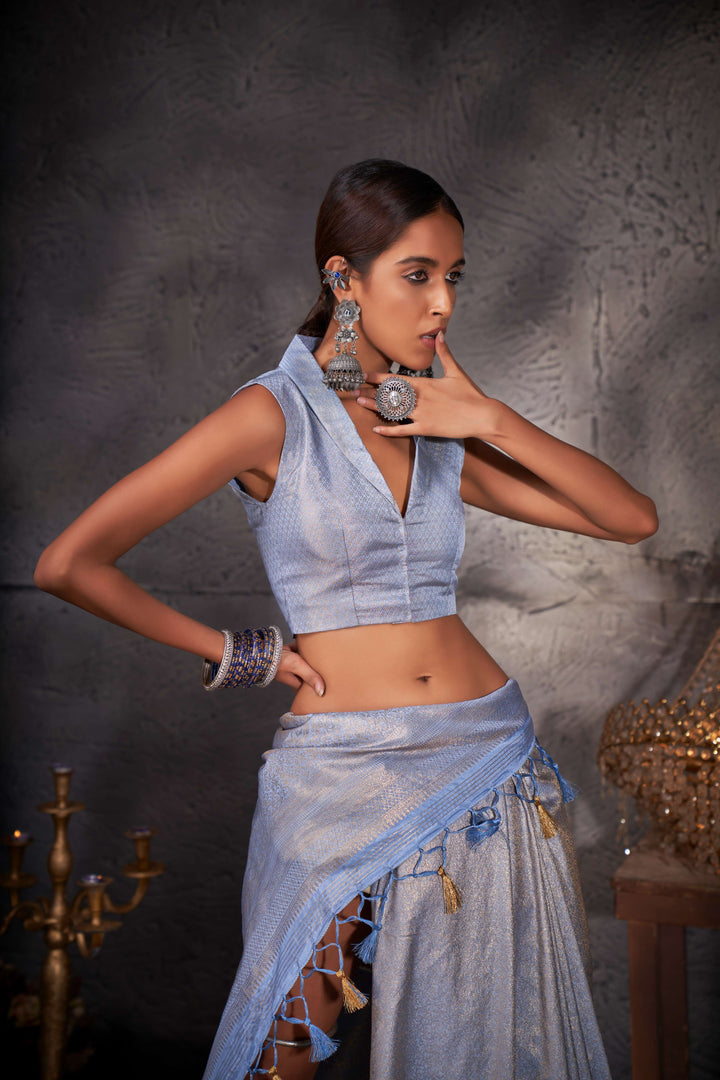 Close-up of gold zari motifs on the pallu and border