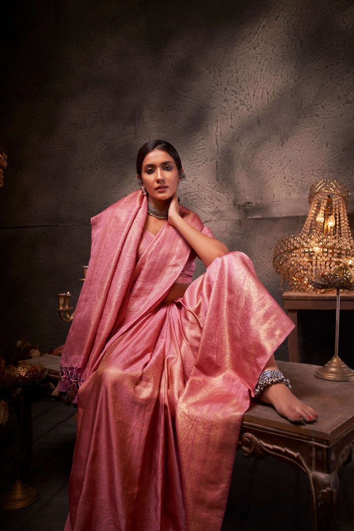 Flat lay of the saree and matching unstitched blouse piece, showcasing the cohesive design and color harmony.