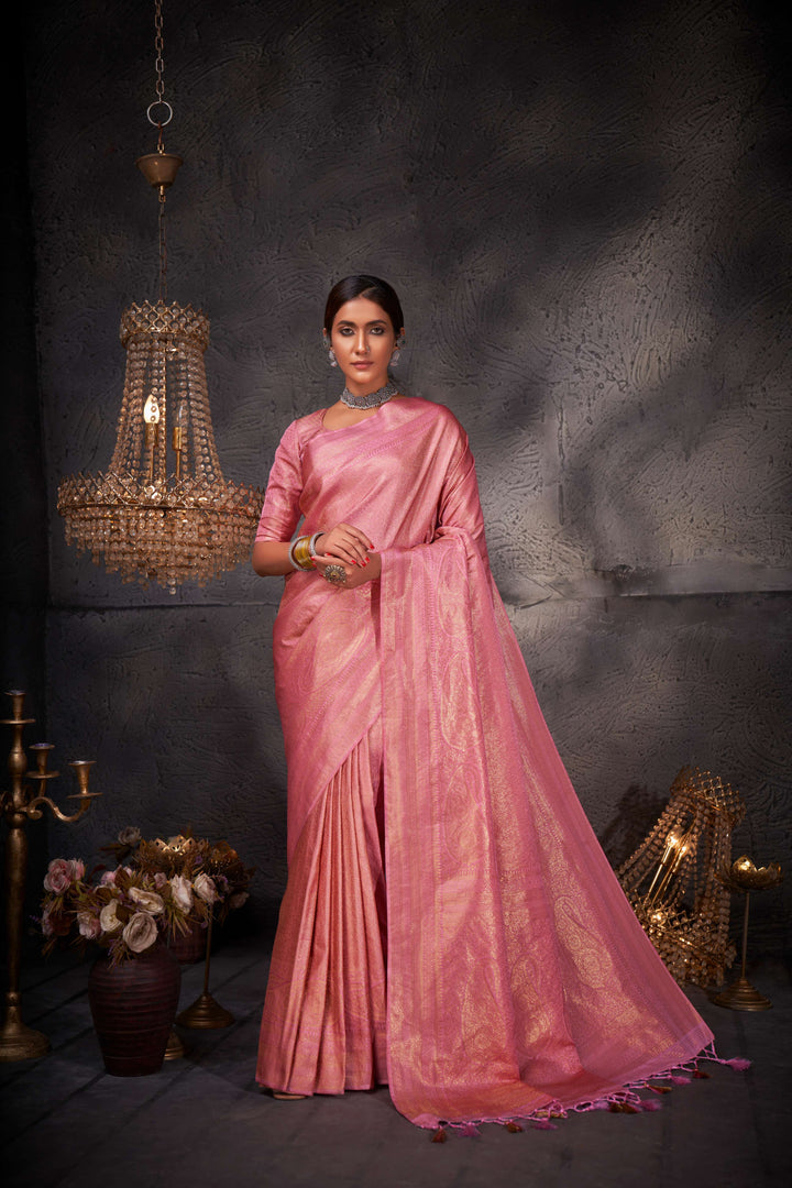 The drape, displaying the graceful fall of the pallu with ornate zari patterns.