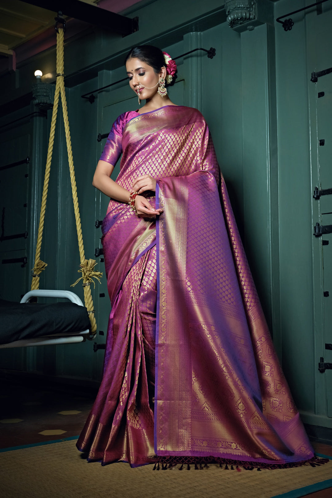 Full saree spread showcasing the rich color and traditional detailing.