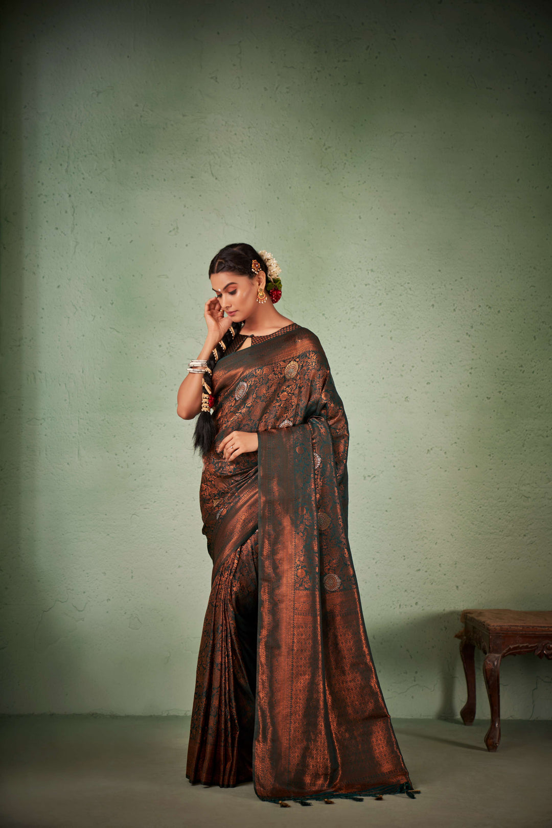 Front and side view of saree styled for a traditional wedding.