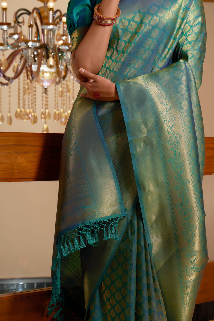 Close-up of the saree's handwoven gold zari on the pallu and border.