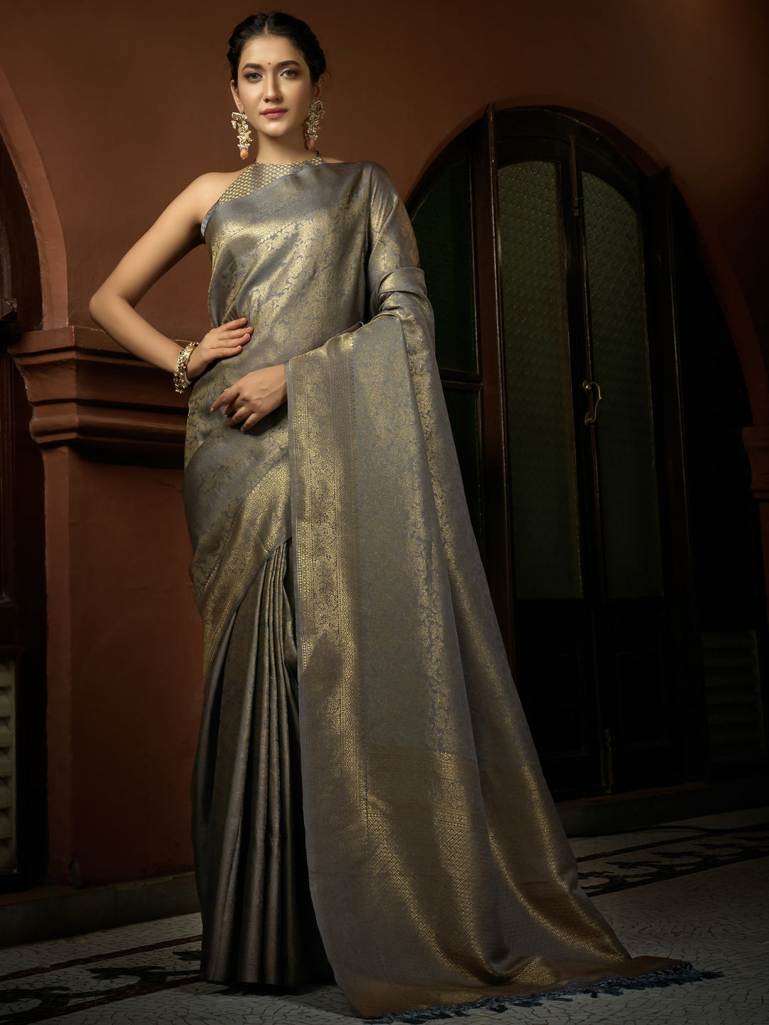 Model in the saree, styled for a formal wedding or festive occasion.