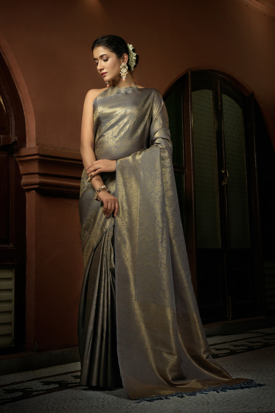 Flat lay image of saree and unstitched blouse piece, showcasing sheen and texture.