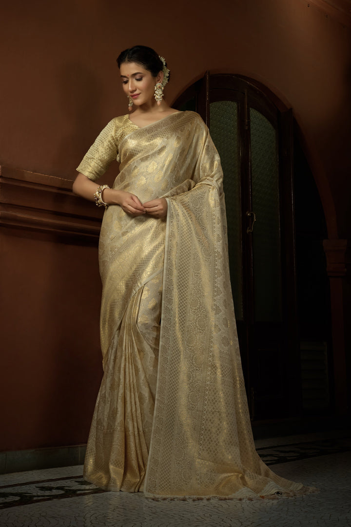 Flat lay of the Vanilla White saree with matching blouse piece, emphasizing fabric quality and coordinated design.