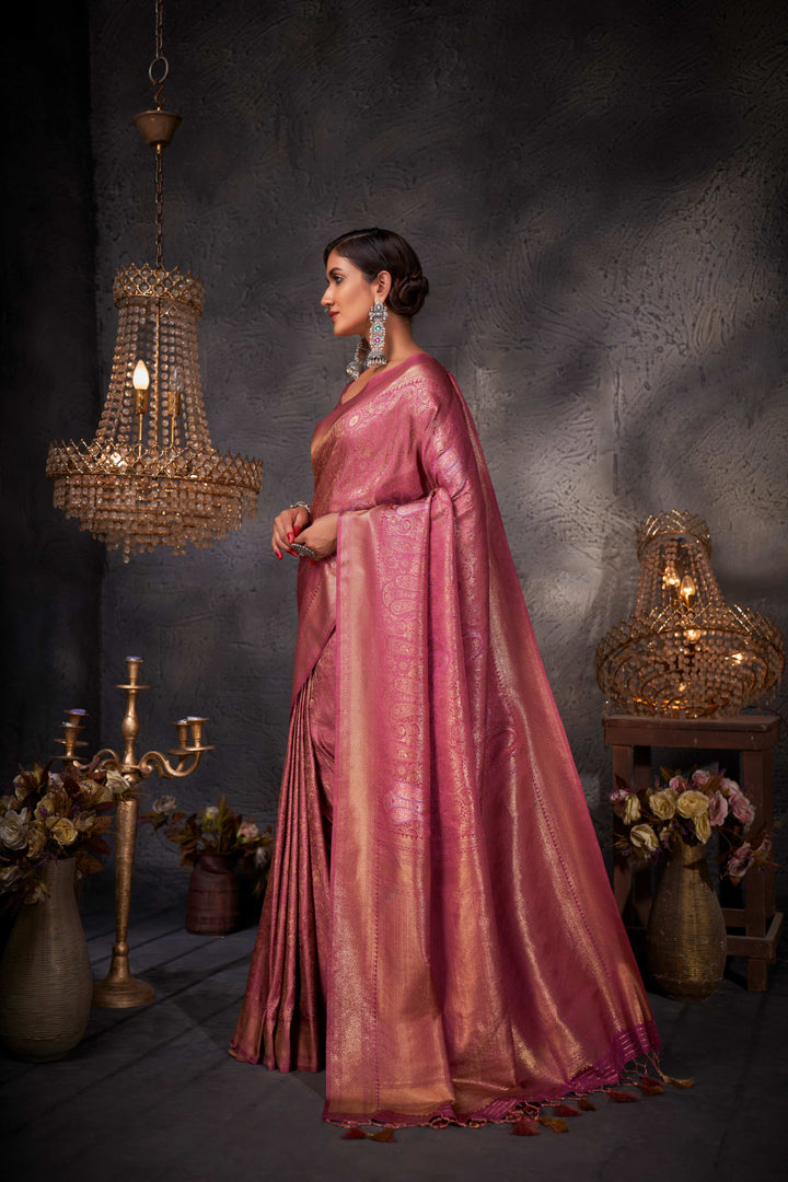 Model showcasing back drape with richly adorned pallu.