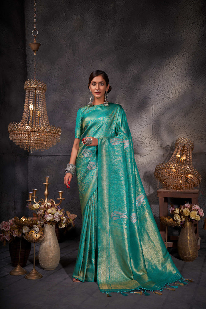 Full-body shot showcasing the saree’s graceful drape and intricate craftsmanship.