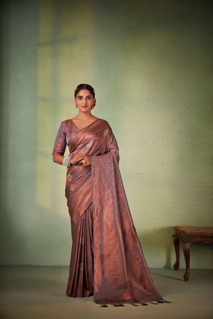 Elegant handwoven Kanjeevaram silk saree with matching blouse.
