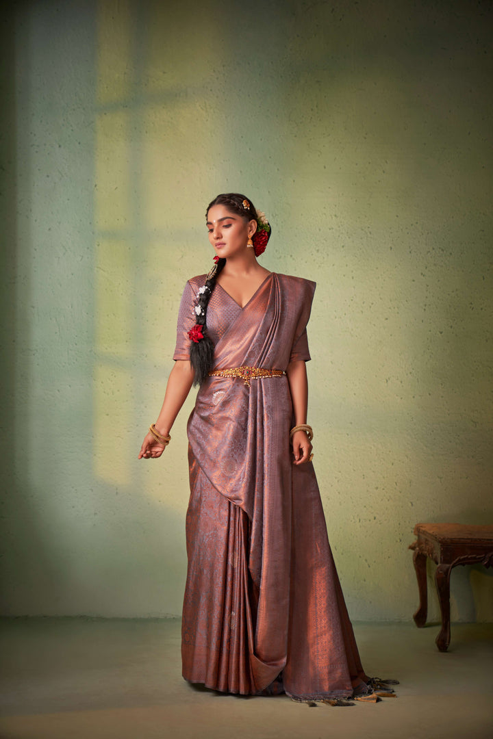 Model styling traditional saree with antique jewelry.