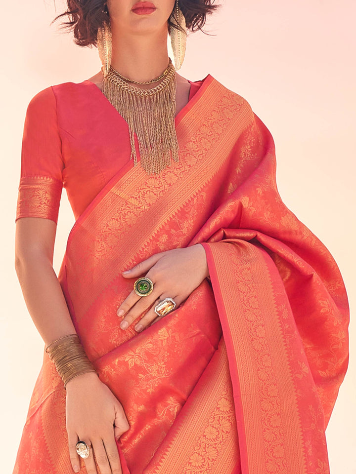 Coral–Gold silk saree featuring classic kanjivaram texture and gold woven elements. Coral–Gold wedding saree with lustrous finish, ideal for vibrant celebrations.
