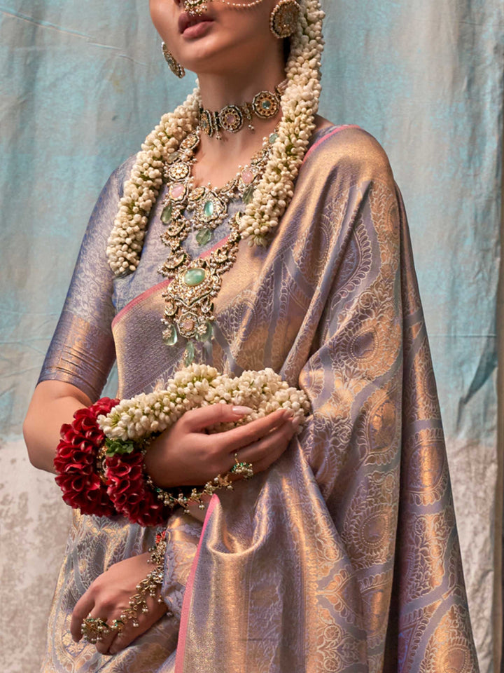 Lavender and Champagne two-tone handwoven silk saree with contrast selvage border and paisley weaving. This image captures the zoomed texture view illustrating fabric weave and print clarity, ideal for visualizing festive elegance, designer appeal, and modern styling inspiration. Perfect for online shoppers seeking detailed previews before purchase, enhancing saree visual merchandising and SEO-rich product display strategy.                                                                                     