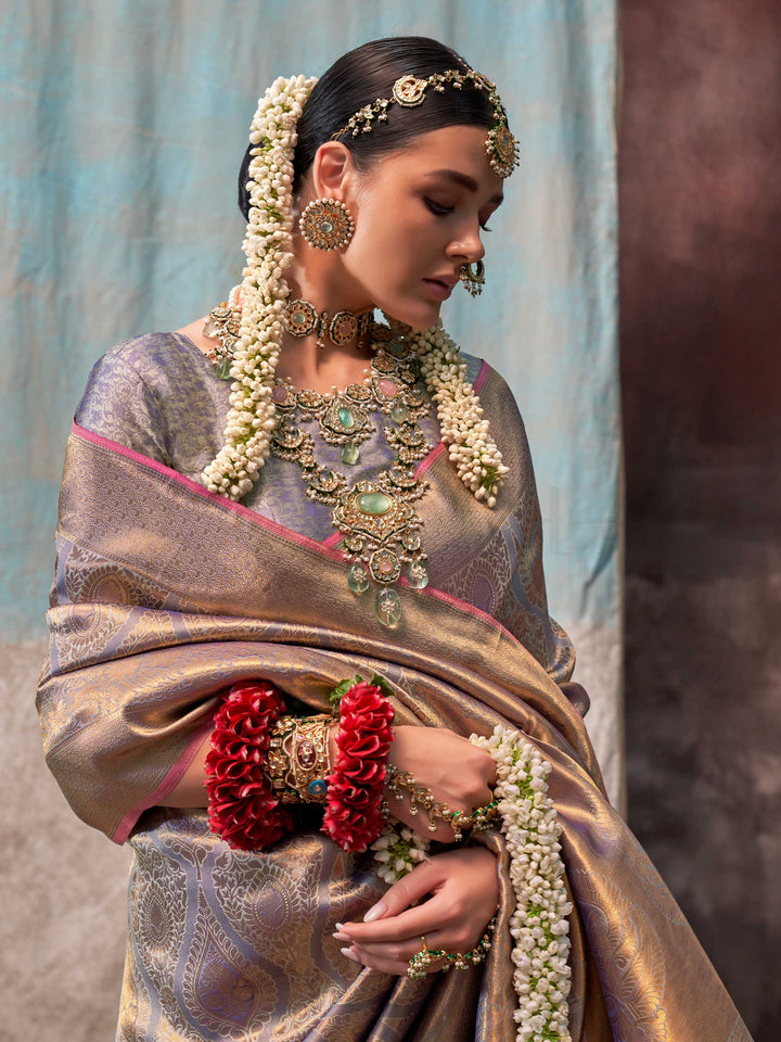 Lavender and Champagne two-tone handwoven silk saree with contrast selvage border and paisley weaving. This image captures the model styling perspective with complete saree ensemble displayed, ideal for visualizing festive elegance, designer appeal, and modern styling inspiration. Perfect for online shoppers seeking detailed previews before purchase, enhancing saree visual merchandising and SEO-rich product display strategy.                                                                                    