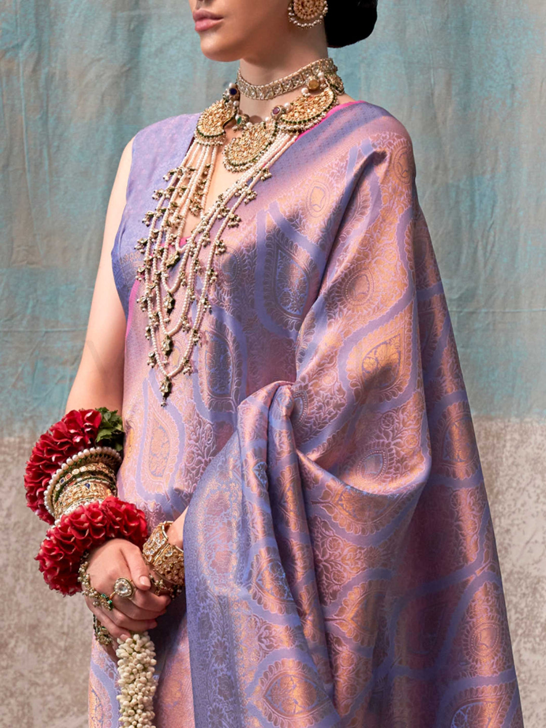 Lilac and Rose Gold two-tone handwoven silk saree with contrast selvage border and paisley weaving. This image captures the zoomed texture view illustrating fabric weave and print clarity, ideal for visualizing festive elegance, designer appeal, and modern styling inspiration. Perfect for online shoppers seeking detailed previews before purchase, enhancing saree visual merchandising and SEO-rich product display strategy.                                                                                        