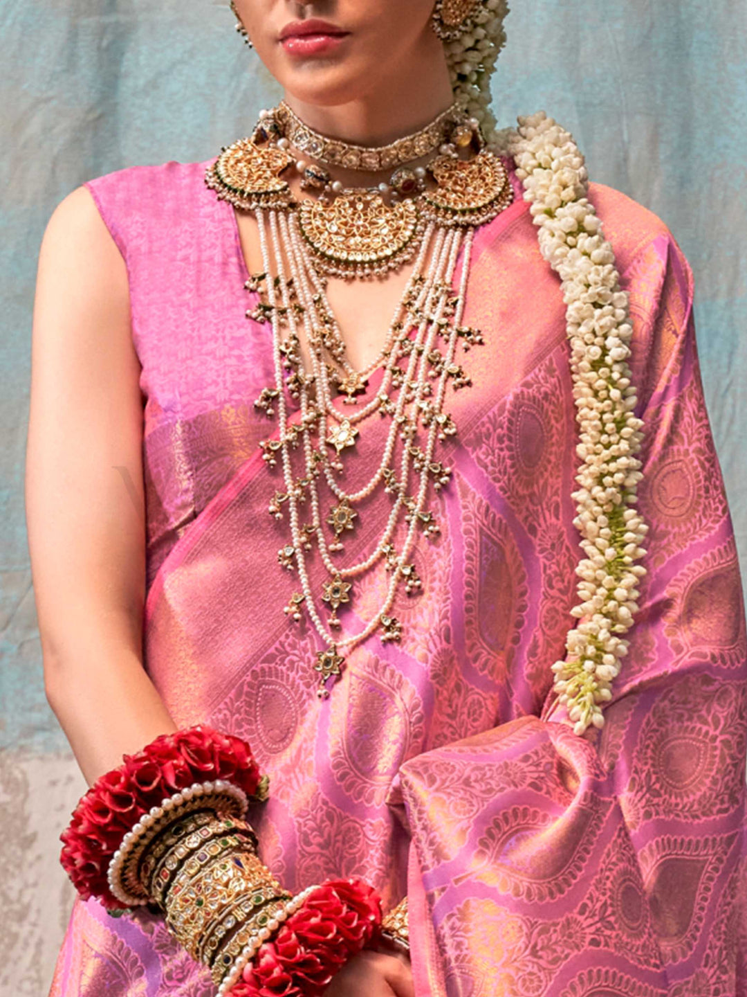 Pink and Rose Gold two-tone handwoven silk saree with contrast selvage border and paisley weaving. This image captures the zoomed texture view illustrating fabric weave and print clarity, ideal for visualizing festive elegance, designer appeal, and modern styling inspiration. Perfect for online shoppers seeking detailed previews before purchase, enhancing saree visual merchandising and SEO-rich product display strategy.                                                                                         
